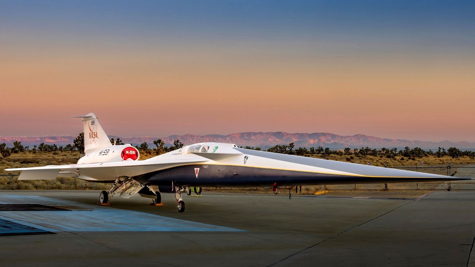 The X-59 jet parked on the tarmac.