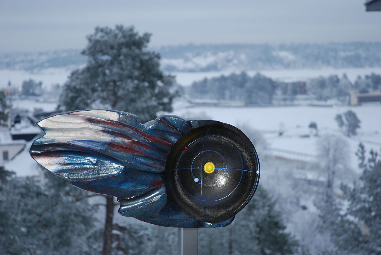 a sculpture of a bird in the snow.